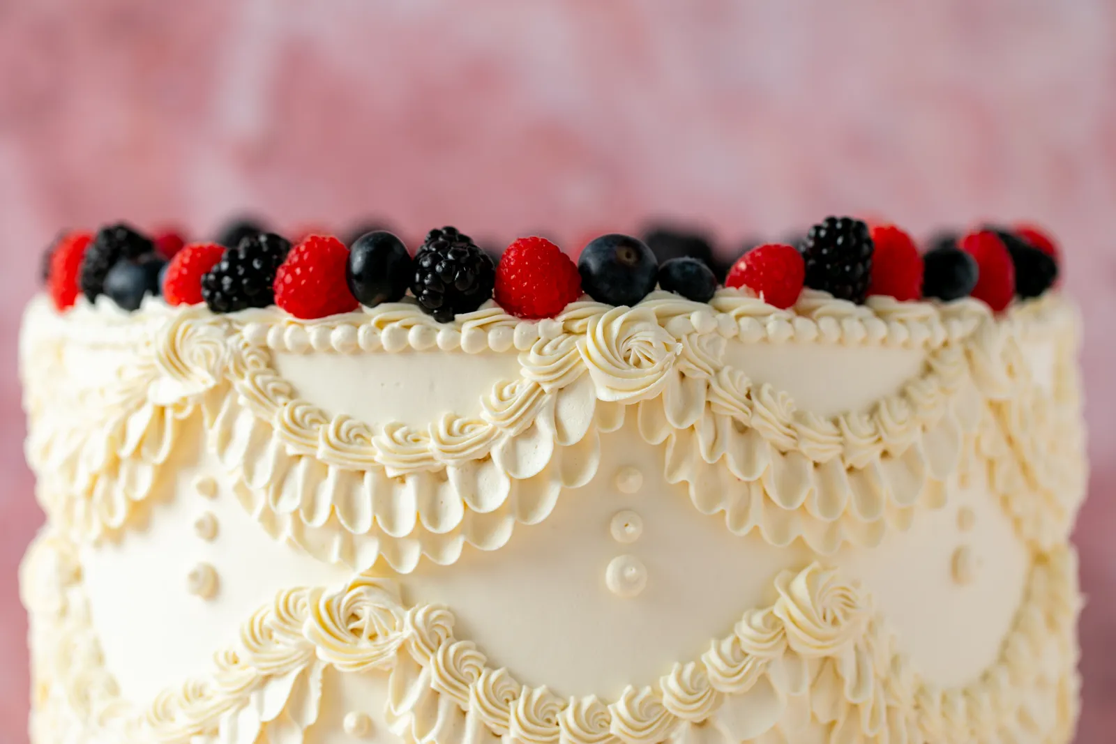 slice-of-heaven-bellingham-pro-lace-berry-cake-wide-closeup image