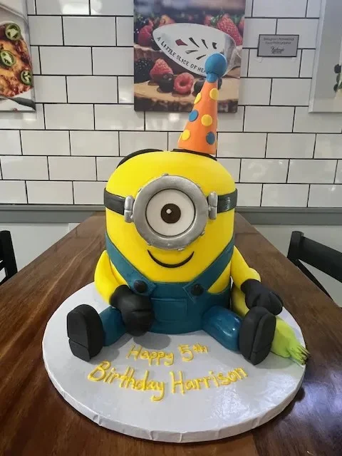 slice-of-heaven-bellingham-custom-cake-minion-party-hat-birthday Image