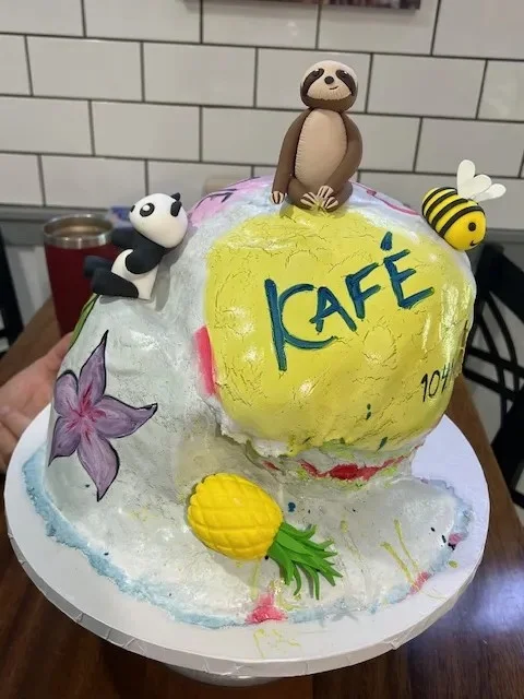 slice-of-heaven-bellingham-custom-cake-tropical-cafe-sloth-panda-bee image