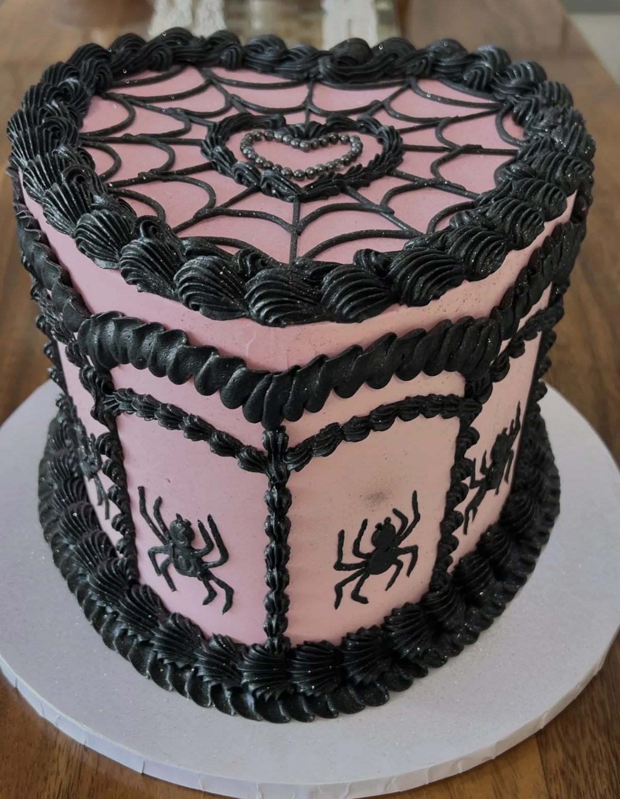 slice-of-heaven-bellingham-sculpted-cake-pink-black-heart-spiderweb image