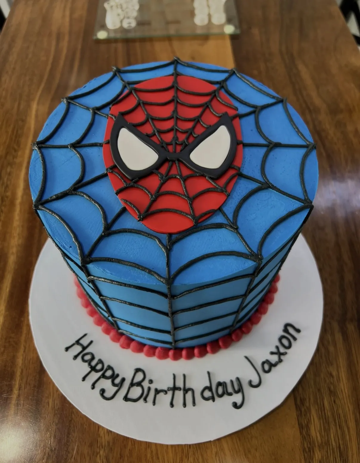 slice-of-heaven-bellingham-sculpted-cake-spider-man-face-web image