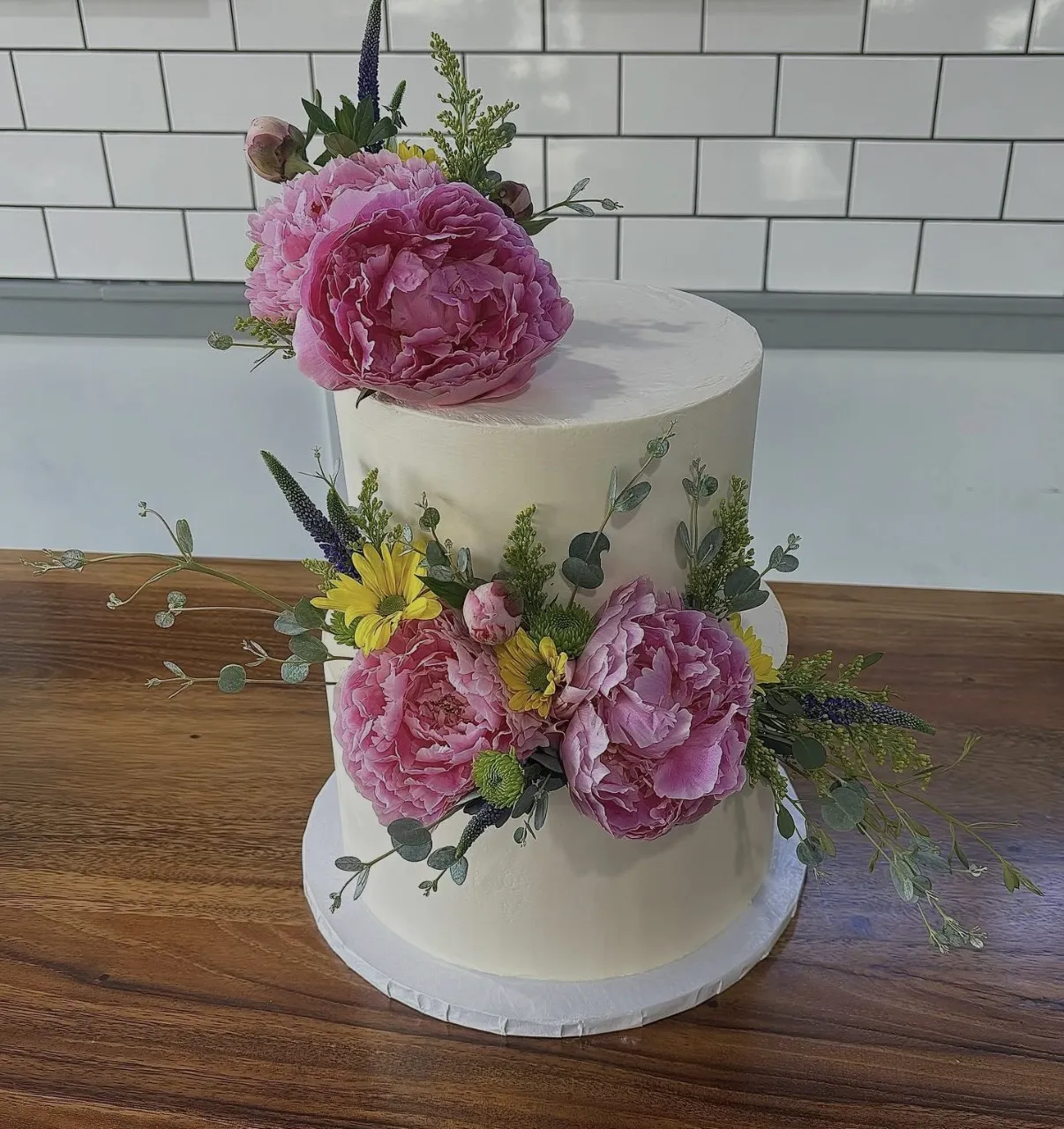 slice-of-heaven-bellingham-sculpted-cake-two-tier-pink-peonies-eucalyptus image